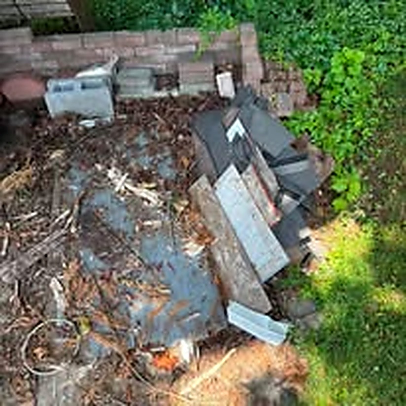 Outdoor brick and debris pile before removal