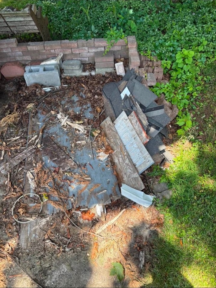 Roofing shingles and brick debris before removal